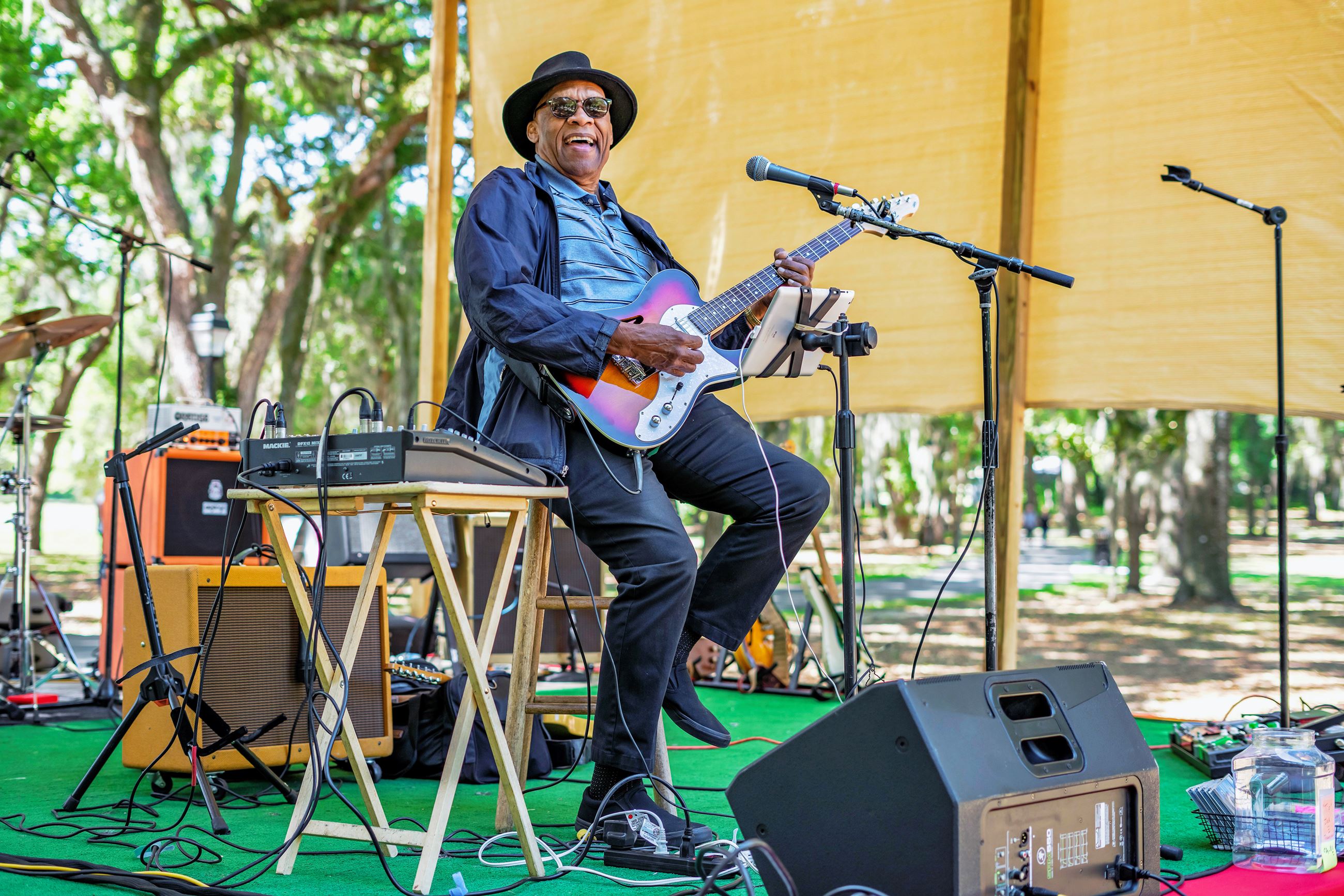 Man playing guitar on stage